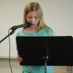Kenna Pryor reads an essay.
