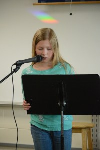 Kenna Pryor reads an essay.