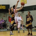 Seldovia’s Calem Collier flies through the air to control the ball in the Seldovia Otters’ game against the Kotlik Falcons state 1A tourney action Saturday.-Photo by McKibben Jackinsky