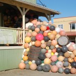 At right, the sculpture flows out of the gallery and fills up part of the porch at Bunnell Street Arts Center. Charzewski guided the art project, using loaned buoys from local fishermen. “Consumption and consumerism is pretty much what I’m conscious of,” he said of his approach to art.-Photo by Michael Armstrong; Homer News