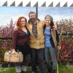 Dan Coe, center, stands with the assistants who helped him paint the fireweed mural, Karen Simpson, left, and daughter Rachel Coe, right. -Photo by Michael Armstrong, Homer News