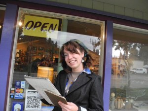 Kristen Tonga sketches outside Ptarmigan Arts last week for First Friday. Tonga was in town visiting family. For a donation, she offered 10-minute portrait sketches.       -Photo by Michael Armstrong, Homer News