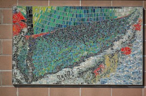 Anchorage artist Sheila Wyne’s mural, “Danny J,” is installed at the End of the Road Park restroom near Land’s End. She also has art at the Deep Water Dock bathrooms.-Photo by Michael Armstrong, Homer News