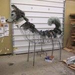 The metal frame created by Homer High School students gives shape to a sculpture of the Homer Middle School Husky.-Sarah Richardson