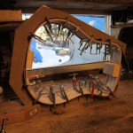 An instrument being glued frames the view out Ray DeMeo’s Anchor Point home.-Sarah Richardson