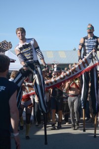 Stilt walkers Kylee Wegner, left, and Phill Stasz, right, lead March Fourth as the Portland, Ore., band parades during Salmonfest on Sunday. Sunshine blessed the three-day music festival at the Kenai Peninsula Fairgrounds, Ninilchik.-Photo by Michael Armstrong. Homer News