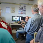 Drift boat fishers pass the sonar station at its location just upstream from the Sterling Highway bridge on the Kasilof River. -Peninsula Clarion file photo