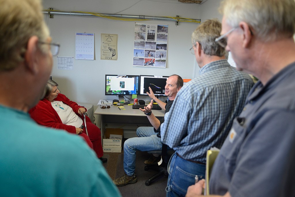 Drift boat fishers pass the sonar station at its location just upstream from the Sterling Highway bridge on the Kasilof River. -Peninsula Clarion file photo