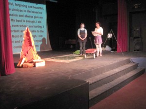 Bonfire on the Bay Speaker Sierra Smith and volunteer audience member Sabina Karwowski take the stage during the Bonfire on the Bay event.-Photo provided