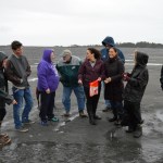 A group of Homer Jews gather on Bishops Beach to throw pieces of bread into the water on Sept. 13. The bread symbolizes sins, and the practice is part of the Jewish holiday of Tashlich, a day of repentance.-Photo by Annie Rosenthal
