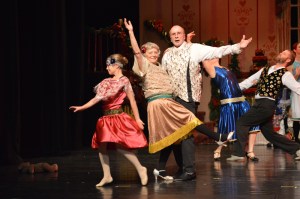 Aiyanna Cline dances as Clara and Jackie Dentz and Jim Hornaday as the grandparents Stahlbaum.-Photo by Annie Rosenthal, Homer News