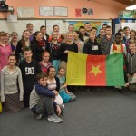 The high school students at Nikolaevsk School pose with Nouredine Mama, an exchange student from Cameroon in Homer for the year.-Photo by Annie Rosenthal