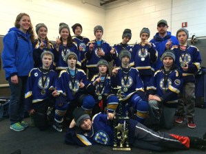 The Homer Hockey Association’s Pee Wee C (III) took the tournament title at the 2016 Annual Moose Fest in South Anchorage at the Subway Arena on Jan 15, 16 and 17, coming out on top of six teams. Homer played and won three games to make it into the championship. They played Anchorage Comets for the championship, and won 5-0. The Comets were the reigning state championship team from last year. Standing, from left, are  Assistant Coach Joanna Riley, Fiona Hatton, Delilah Harris, Micah Williamson, Aiden Arno, Terry Gilliland, Haylee Owen, Coach Chris Owen and Dylan McBride. Front row, from left, are Casey Otis, Kazden Stineff, Owen Pitzman, Hunter Green and Timmy Hatfield. On floor in front is Keegan Strong, goalie.-Photo by Derotha Ferraro
