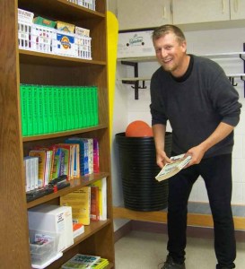 West Homer Elementary School sixth-grade teacher Brandon Young prepares his room at the start of the 2013-2014 school year. Young is a former Paul Banks Elementary School teacher and is back at West Homer for the 2014-2015 school year.-Photo by McKIbben Jackinsky, Homer News