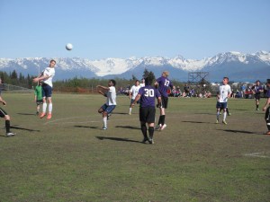 Kaveh Anderson, left, looks to head the ball to teammate Max Mangue during Saturday’s game.-Photo by Shannon Reid