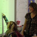 Madilyn Illg marks herself as present in Paul Banks teacher Wendy Todd’s kindergarten classroom.