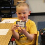 Student Jack Faber, right, says good-bye to his sister Emilly and dad Jack on his first day of kindergarten at Paul Banks Elementary School.