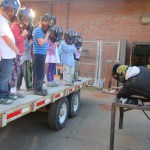 At Homer High School, Mickey Todd shows first-graders how a torch works.  -Photo provided