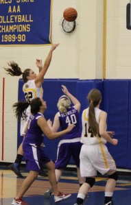 Mariner Tayla Cabana, 32, sends the ball over the heads of Skyview Panthers, with Madison Akers, 14, ready to back her up.-Photo by McKibben Jackinsky, Homer News