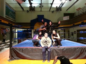 Wrestlers, from left, Julie Winters, Calvin James, Darious Douglas, and Marco Kaloa pose with Charlie Higley of Barb’s Video.-Photo  by Katir Britton, Homer News