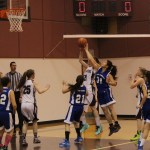 Fort Yukon’s Mariah Peter, 31, attempts to stop Nikolaevsk’s Serafima Kalugin’s shot at the basket in the opening minutes of Friday’s game between the two schools during Nikolaevsk’s Warrior Rumble basketball tournament. -Photo by McKibben Jackinsky, Homer News