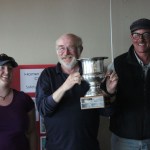 Craig Forrest, center, is the winning regatta captain. He is shown with crew members Kelsey Kleine, left, and Johann Willrich, right. Not pictured, Liska Kandror.-Photo by McKibben Jackinsky, Homer News