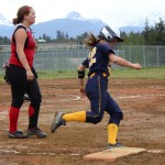 Mariner Maggie LaRue charges part first base during Monday’s game.-Photo by McKibben Jackinsky, Homer News