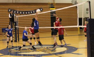 While the varsity was away, the Mariners JV and C teams played at-home volleyball against the Seldovia Otters and Ninilchik Wolverines. The C team won all three games and the JV won two. Above, Kendra Raymond, 4, Elsie Smith, 15, and Sofia Ramirez-Clark, 6, send the action back to the Seldovia Otters’ side of the court during a Saturday game.