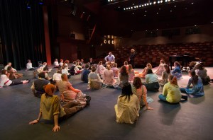 Homer High School choir director Kyle Schneider and choreographer Jill Berryman coach students in preparation for Pirates of Penzance.-Photo by Axel Gillam