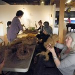Ann-Margaret Wimmerstedt, right, works on a fish sculpture during a workshop with Melissa Daubert, left, last Saturday at Bunnell Street Arts Center.                               -Photo by Michael Armstrong, Homer News