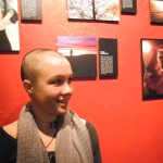 Molly Mitchell stands next to her photograph, “Gratitude" at the First Friday opening of the PhotoVoice exhibit at K-Bay Caffe.                          -Photo by Michael Armstrong, Homer News