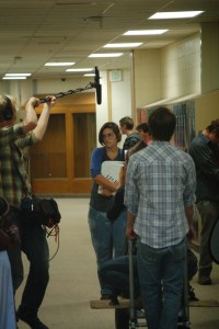 Sydney Paulino, center, acts in a scene from “Break the Silence” during filming in August.-Photo by Michael Armstrong, Homer News