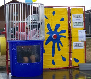 Homer City Manager Walt Wrede drops into the dunk tank-Photo by McKibben Jackinsky, Homer News