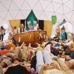 Visitors play the drum at “prayerformances” around the world.-Photo provided