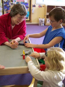 Pat Kennedy a 16-year teachers assistant at Head Start visits with Einar and Addy Pederson during “Family Day” at Head Start last Saturday.-Photo by McKibben Jackinsky, Homer News