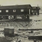 Copy of a photo showing Land’s End up on cribbing to keep it above the high tide following the 1964 earthquake. -Copied with permission of Jon Faulkner.