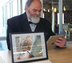Ken Castner prepares his comments for Saturday’s Celebration of Life Long Learning.-Photos by McKibben Jackinsky, Homer News