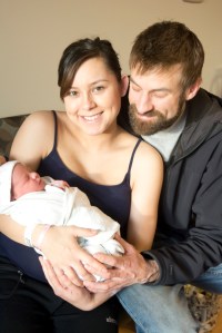 Mary and Jamie Rault hold their new baby, Skyler Louise Rault, Homer’s first baby of the year.-Photo by Michael Armstrong, Homer News
