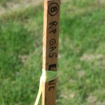 A survey stake shows the border between private property and a utility right of way. The number at top indicates how many feet into the right of way the actual gas line will be dug — in this case, “8,” for 8 feet.-Photo by Michael Armstrong, Homer News