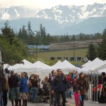 Visitors to the 2012 Homer Council on the Arts Street Faire stroll down Hazel Avenue and look at booths.-Photo by Michael Armstrong, Homer News