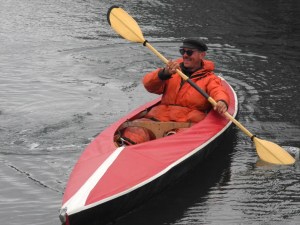 Johann-Christoph Georg Willrich paddles a Folbot kayak at the Kachemak Bay Wooden Boat Festival. He found the kayak at the Homer dump and asssembled it at the festival last Saturday.