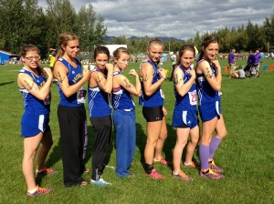Homer varsity runners (from left) Pam Jantzi, Aurora Waclawski, Molly Mitchell, Shenandoah Lush, Aziza Shemet Pitcher, Lauren Everts and Megan Pitzman prove their strength — and speed — at the Palmer Invite.-Photo by Alayne Tetor, Homer High School assistant running coach
