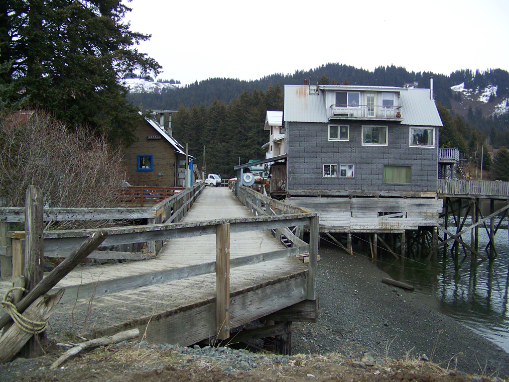Above, a boardwalk was once the main thoroughfare in Seldovia. Now only a small section of it remains. At left, Saint Nicholas Russian Orthodox Church remains from “the old days.”-Photos by McKibben Jackinsky, Homer News