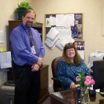 New Homer High School Principal Doug Waclawski and Secretary Cindy Koplin get the school year off with smiles on Tuesday.-Photo by McKibben Jackinsky, Homer News