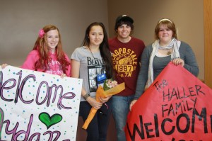 Aydana Omar of Kazakhstan (second from left) is welcomed to Seldovia by members of her host famiily including  Taylor Haller (left), Chance Haller (second from right) and Ashley Haller Ritchie (right).-Photo provided