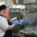 Kaylee Alward is busy at work in South Peninsula Hospital’s kitchen.-Photo by McKibben Jackinsky, Homer News