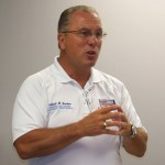 Bob Becker of Incident Management Solutions, Inc., stresses role of communication in emergency preparedness.-Photo by McKibben Jackinsky, Homer News