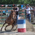 Beth Fowler cuts a tight corner during barrel racing.-Photo by McKibben Jackinsky, Homer News