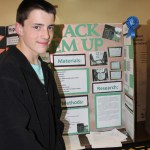 Tyler Johnson, eighth grade, earned a blue ribbon for his project on identifying the size of moose racks from a distance.-Photo by McKIbben Jackinsky, Homer News
