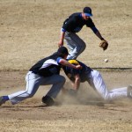 At left, Brian Rowe, No. 9, slides into second base in game number three against Palmer.